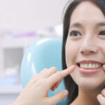 Woman talk to dentist in dental clinic